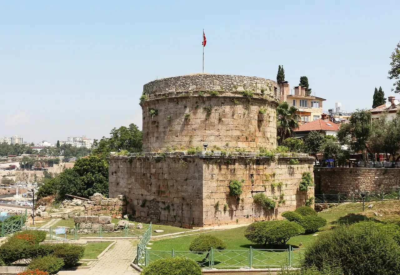 The round Roman Hıdırlık Tower on the cliff edge in Antalya
