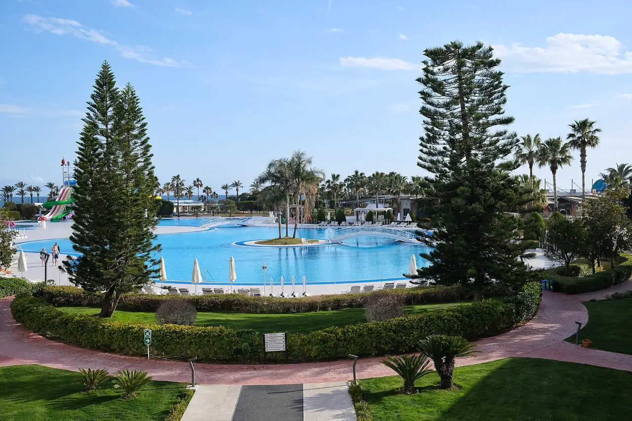 The pool and gardens of a large beach resort near Antalya