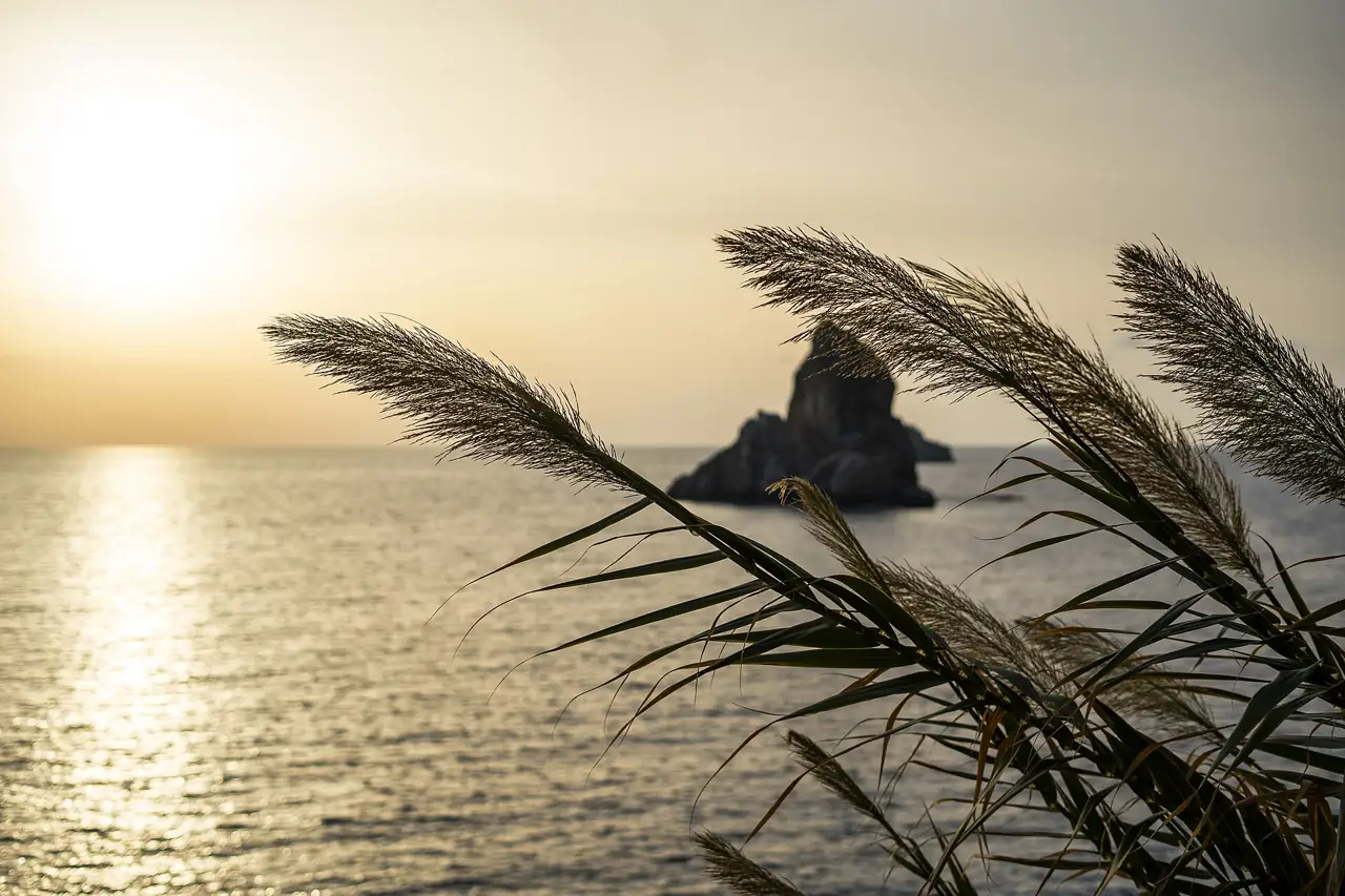Sunset over the sea and a rocky islet near Gazipaşa