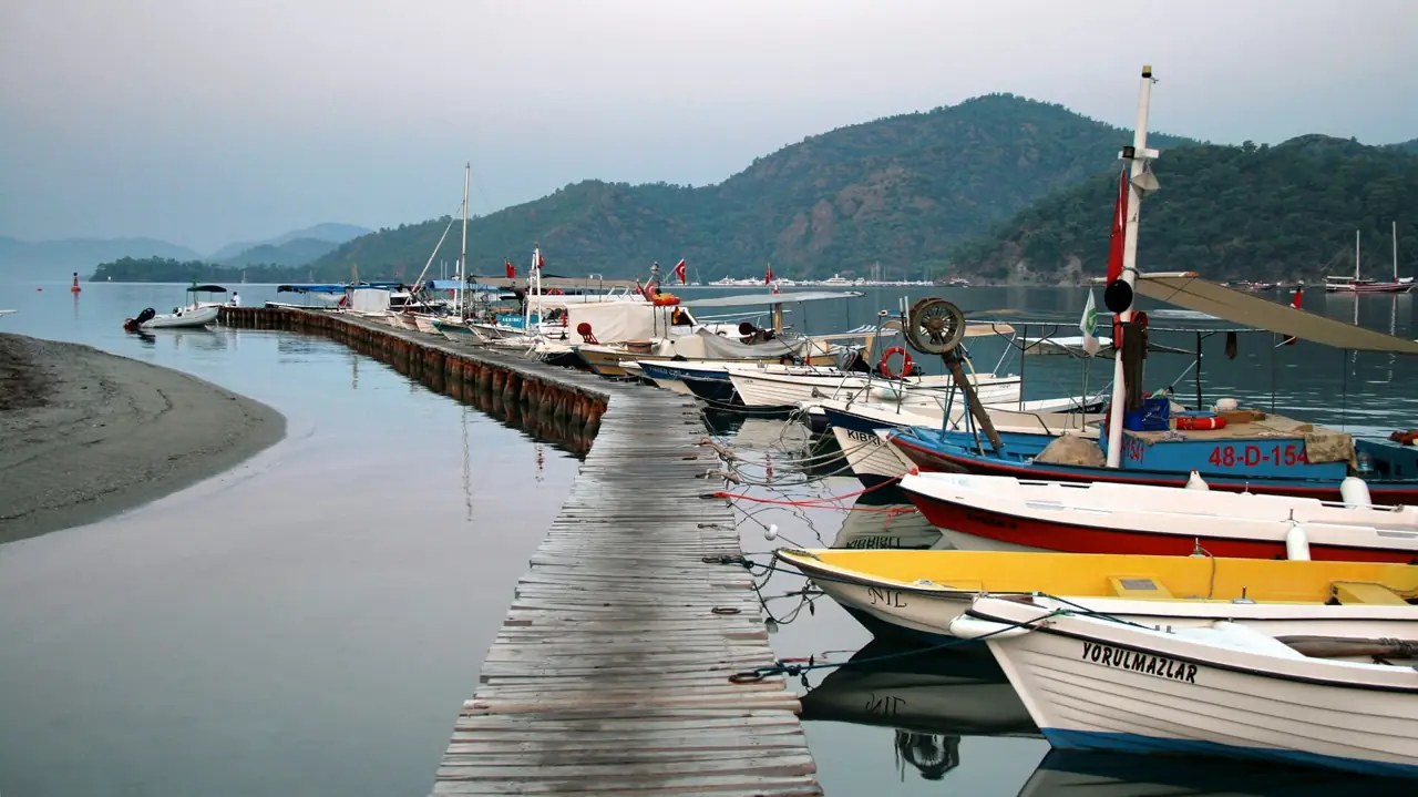 Boats along a wooden jetty at the marina in Göcek